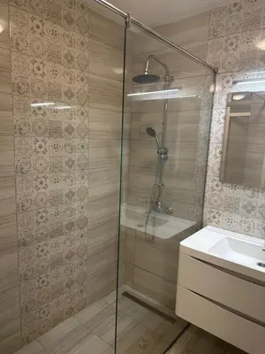 a bathroom with a shower and a sink at Stan in Zenica