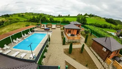 an aerial view of a house with a swimming pool at EJDE RESORT Šiljkovača in Velika Kladuša