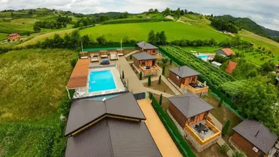 an aerial view of a house with a swimming pool at EJDE RESORT Šiljkovača in Velika Kladuša