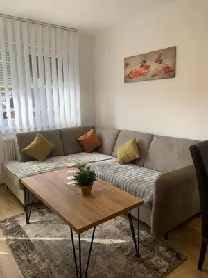 a living room with a couch and a coffee table at Stan na dan Gradiška in Bosanska Gradiška