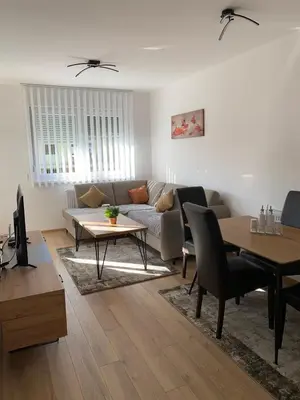 a living room with a couch and a table at Stan na dan Gradiška in Bosanska Gradiška