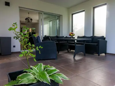 a living room with couches and a table at Villa Rio Verde in Bihać