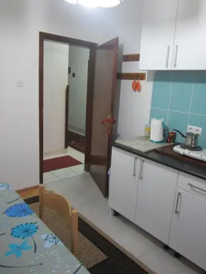 a kitchen with a table and a counter top at Bravo Guest House in Bihać