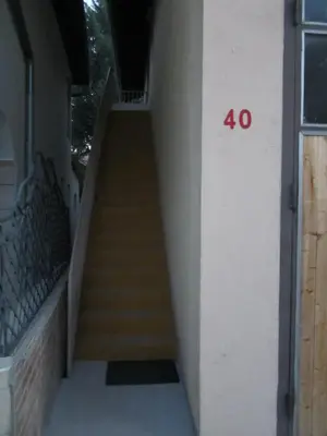 a stairway with a number on the side of a building at Bravo Guest House in Bihać