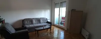 a living room with a couch and a chair at Sofi in Rebrovac