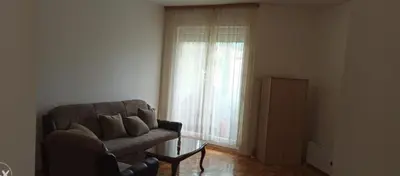 a living room with a couch and a window at Sofi in Rebrovac