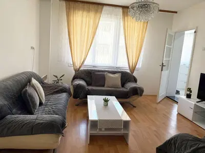 a living room with a couch and a coffee table at Vacation Home Maja in Visoko