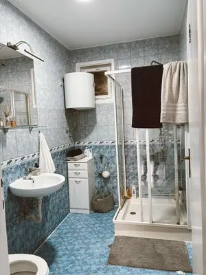 a bathroom with a shower and a sink at Vacation Home Maja in Visoko