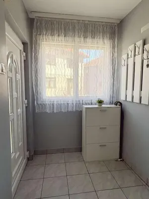 a room with a window and a dresser in front of it at Vacation Home Maja in Visoko