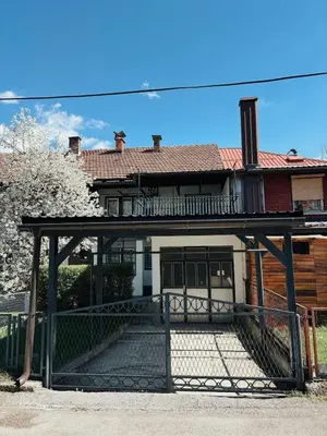 a house with a gate in front of it at Vacation Home Maja in Visoko