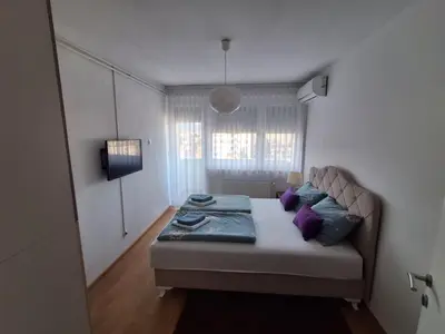 a bedroom with a bed in a room at Esma 2 in Bihać