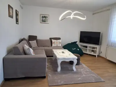 a living room with a couch and a coffee table at Esma 2 in Bihać