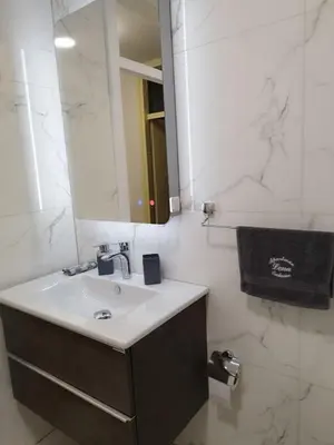 a bathroom with a sink and a mirror at Lena Exclusive in Bihać