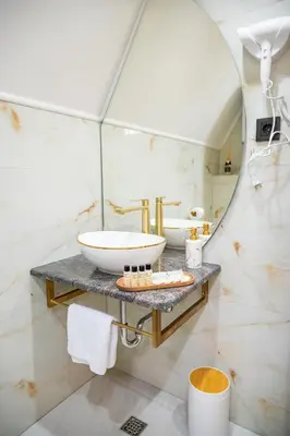 a bathroom with a sink and a mirror at Cottage NIKA2 in Jajce