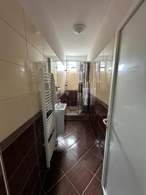 a bathroom with a toilet and a sink at Apartman Orhideja za 4 osobe in Sanski most