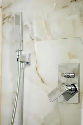 a lightswitch on a wall in a bathroom at Apartman Luxury Kiseljak in Kiseljak