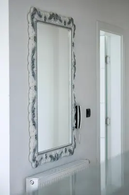 a mirror on a wall in a bathroom at Apartman Luxury Kiseljak in Kiseljak