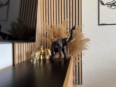 a statue of a dog and three cats sitting on a table at Apartman N&N in Bihać