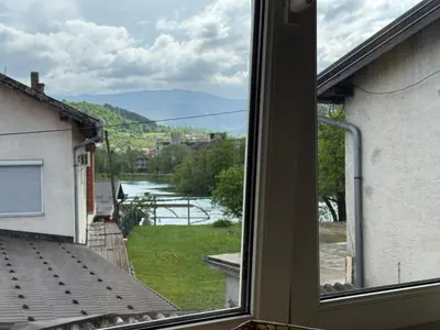 a view of a river from a window at Apartman N&N in Bihać