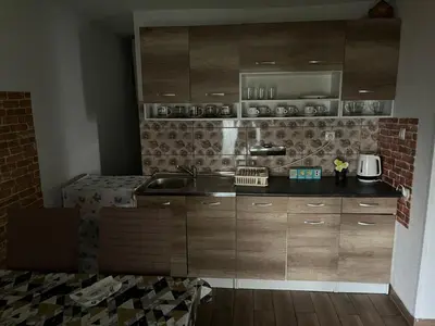 a kitchen with a sink and a counter top at Apartman Iman in Bihać