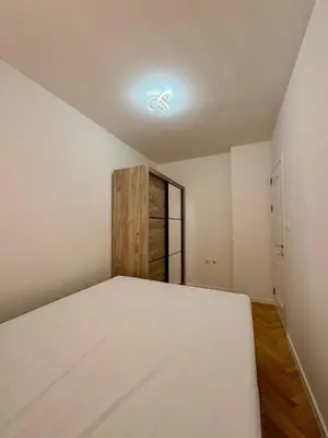 a bedroom with a bed and a window at Apartman 21 Lux in Banja Luka