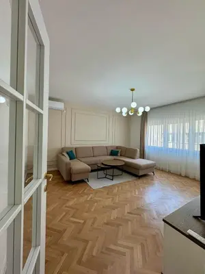 a living room with a couch and a table at Apartman 21 Lux in Banja Luka