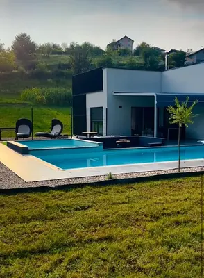 a house with a swimming pool in a field at Residence Deluxe Ljubijankici in Ljubijankići