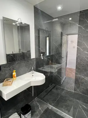 a bathroom with a sink and a shower at Residence Deluxe Ljubijankici in Ljubijankići