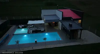 a house with a swimming pool and a building at Residence Deluxe Ljubijankici in Ljubijankići