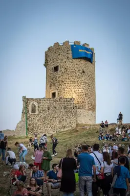 a crowd of people standing in front of a castle at Apartman NAFO in Bihać
