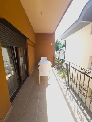 a balcony with a table and chairs on it at Milky Way in Bihać