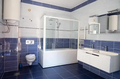 a bathroom with a shower and a toilet and a sink at Milky Way in Bihać