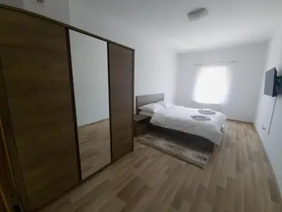 a bedroom with a bed and a large mirror at Milky Way in Bihać