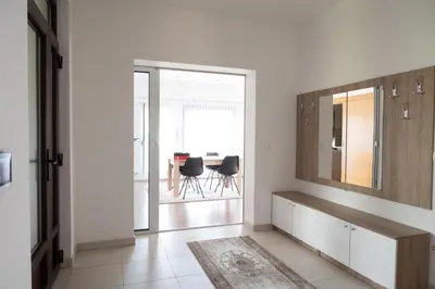 a living room with a mirror and a table at Milky Way in Bihać