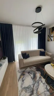 a living room with a couch and a table at Stan Tešanj in Tešanj