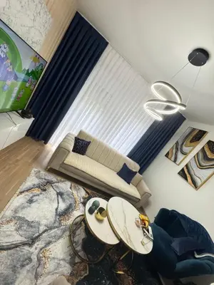 a living room with a couch and a table at Stan Tešanj in Tešanj