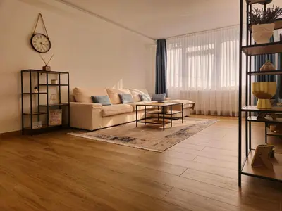 a living room with a couch and a table at Apartman Trg 892 in Livno