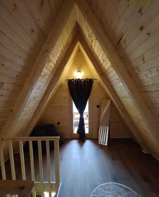 a room in a log cabin with a window at Cottage MIRNI RAJ in Jajce