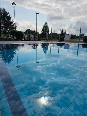 a large swimming pool with blue water at Camping Stevin ranc in Bosanska Dubica