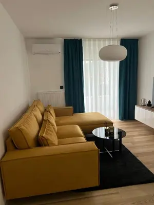 a living room with a couch and a table at Max stan na dan Doboj in Doboj