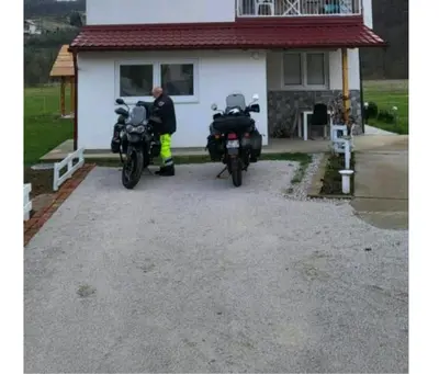 two motorcycles parked in front of a house at Apartman Oaza mira-Visoko in Visoko