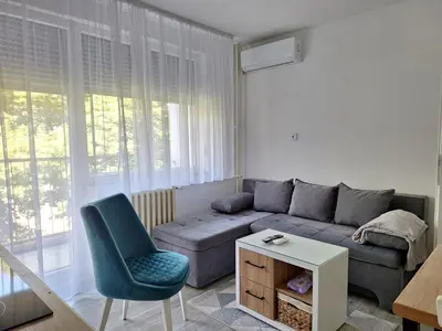 a living room with a couch and a chair at Cosy Corner Doboj in Doboj