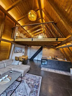 a living room with a couch and a table at Luxury Villa Mašić - 2 in Bugojno