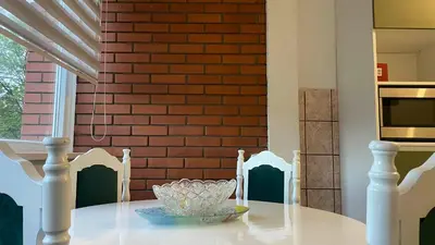 a table with two chairs and a bowl on it at Apartment 3A Visoko in Visoko