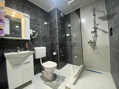 a bathroom with a toilet and a shower at Apartment 3A Visoko in Visoko