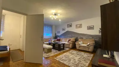 a living room with a couch and a table at Apartment 3A Visoko in Visoko
