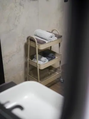 a towel rack with towels on it in a bathroom at Unea House in Bihać