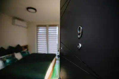 a door to a bedroom with a bed in a room at Apartment Vukeljic in Doboj
