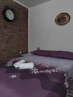 a bedroom with a bed with towels on it at AM Rooms in Visoko