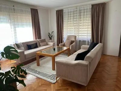 a living room with a couch and a table at Apartman Amy Visoko in Visoko